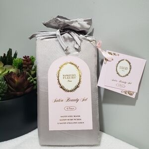 4 pc Satin Sleep Set in Grey includes: 2 Pillowcases 1 Eye Mask 1 Hair Scrunchie